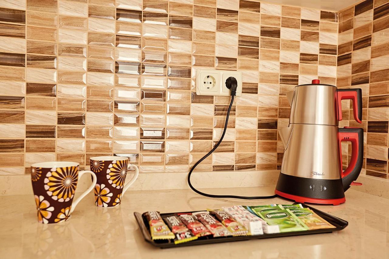 Bursa Suites Apart Otel Exterior photo A kettle plugged into a wall socket