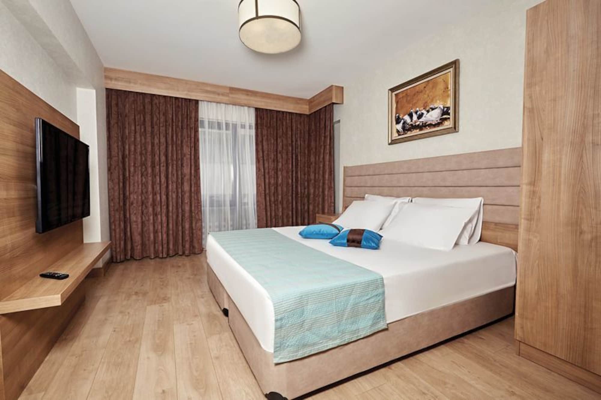 Bursa Suites Apart Otel Exterior photo A bedroom in a hotel